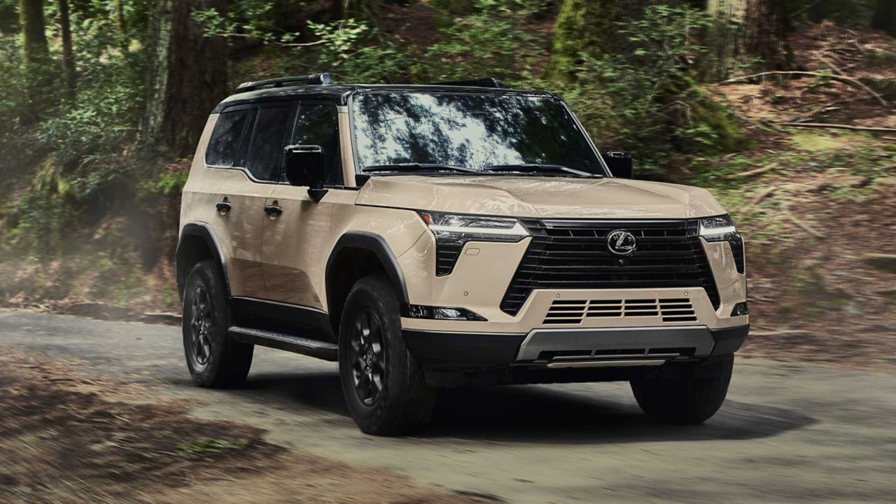 The Lexus GX driving through a forest